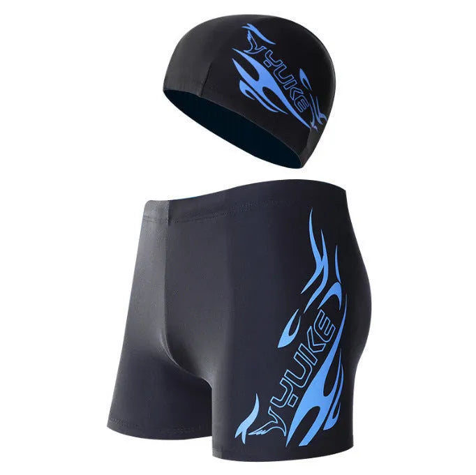 Men's boxer style swimming trunks with matching cap in blue fire design on black background