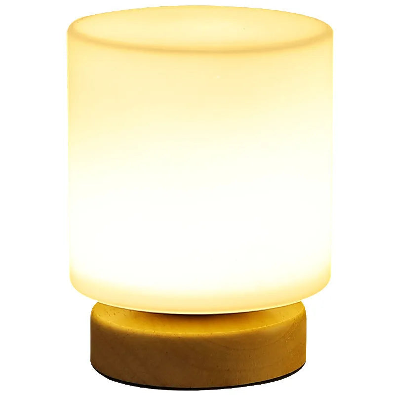 Nordic solid wood USB table lamp with touch dimming in cube style on bedside table