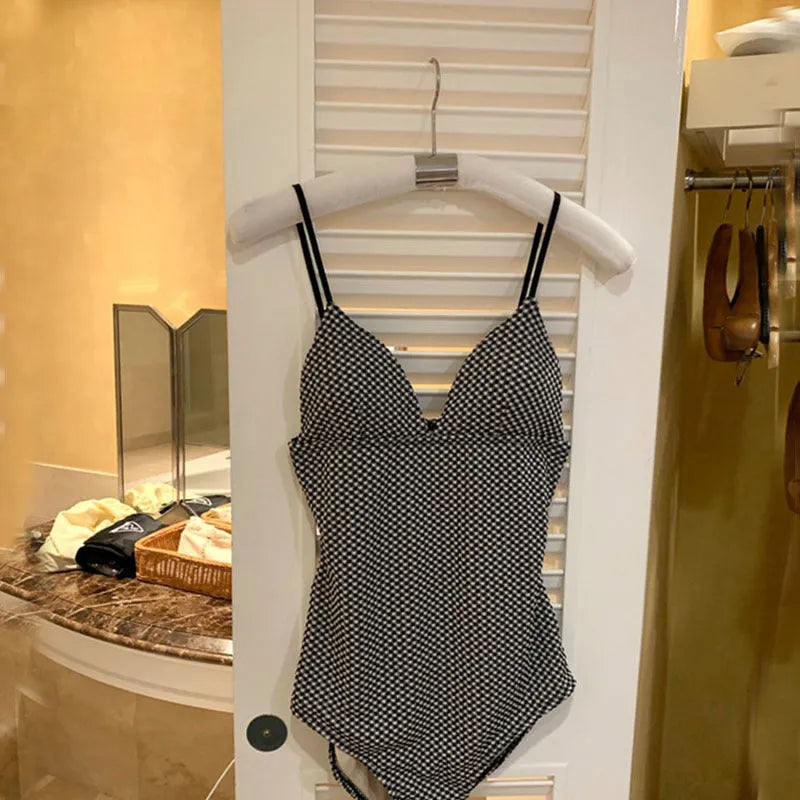 Blue and black one-piece swimsuit for hot springs with belly coverage design