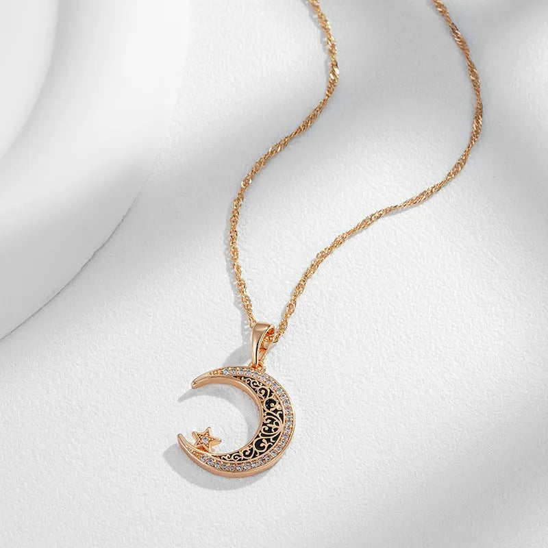 Rose gold star moon pendant necklace with zircon crystals and enamel detailing on water wave chain