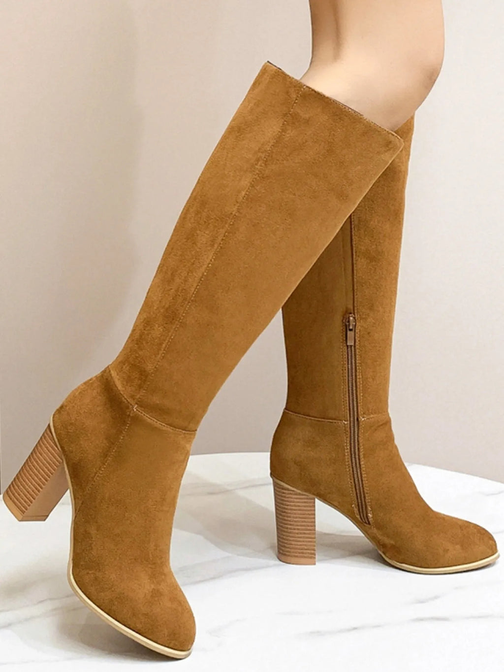 Women's black square toe high heel casual boot made of artificial PU.