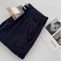 Man wearing beige loose straight-leg casual pants with a drawstring waist, showcasing summer casual style.