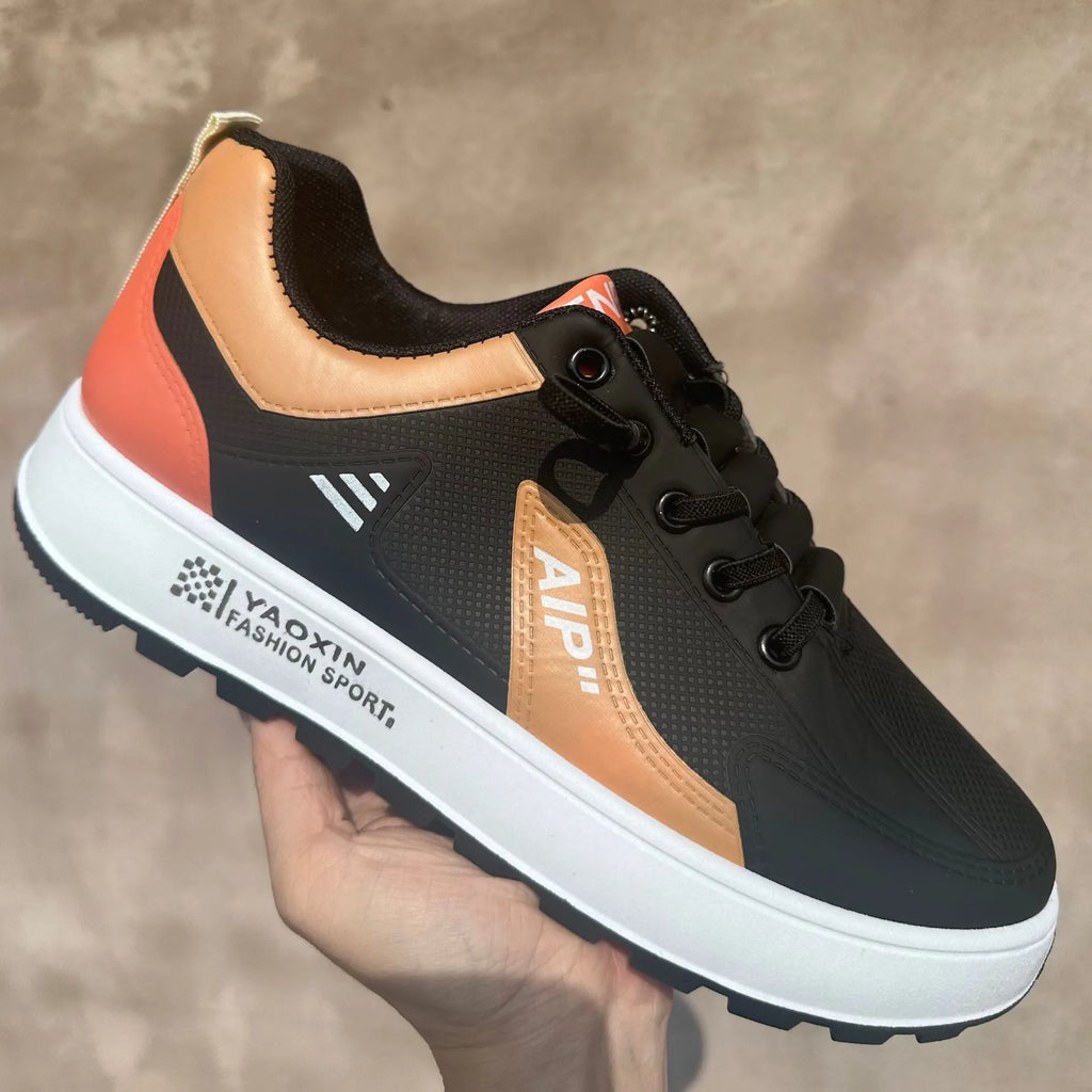 Men's white and black casual shoes with round toe and artificial PU upper.