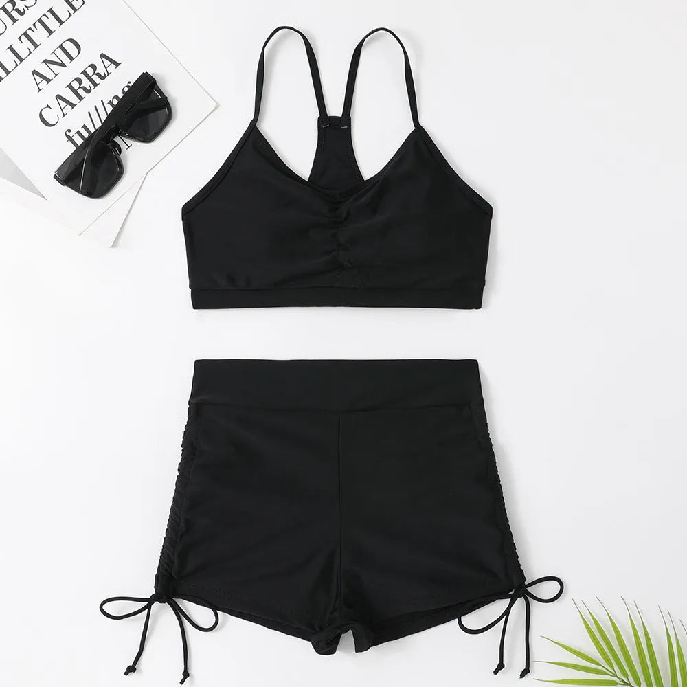 Women's high waist split swimsuit bikini in black or violet colours for swimming activities