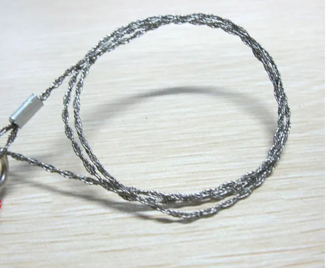 Stainless steel survival wire saw with thumb rings for outdoor cutting