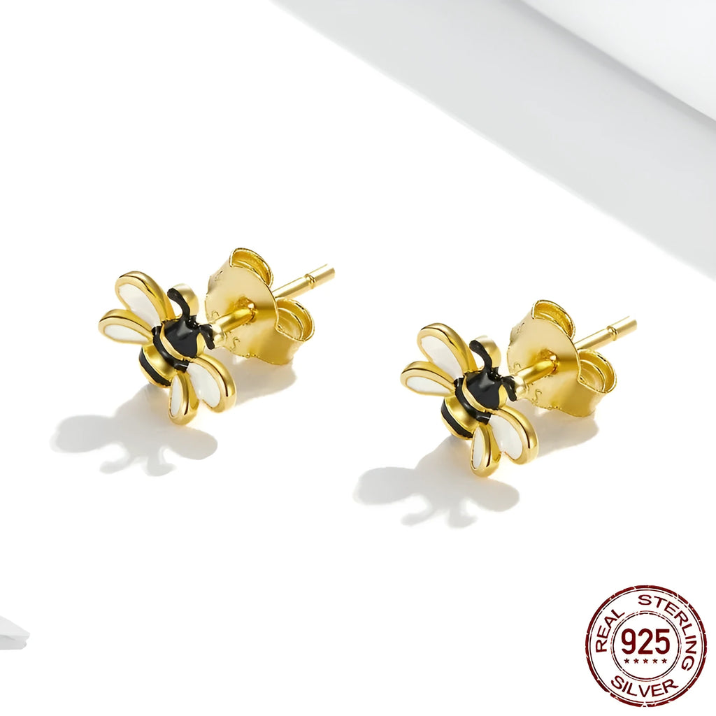 Niche Design S925 silver bee ear studs on a plain background, compact 0.7x0.8cm size