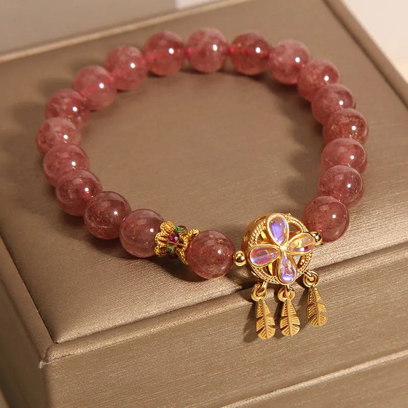 Women's strawberry quartz bracelet with four-leaf clover dream catcher and ball charm pendant