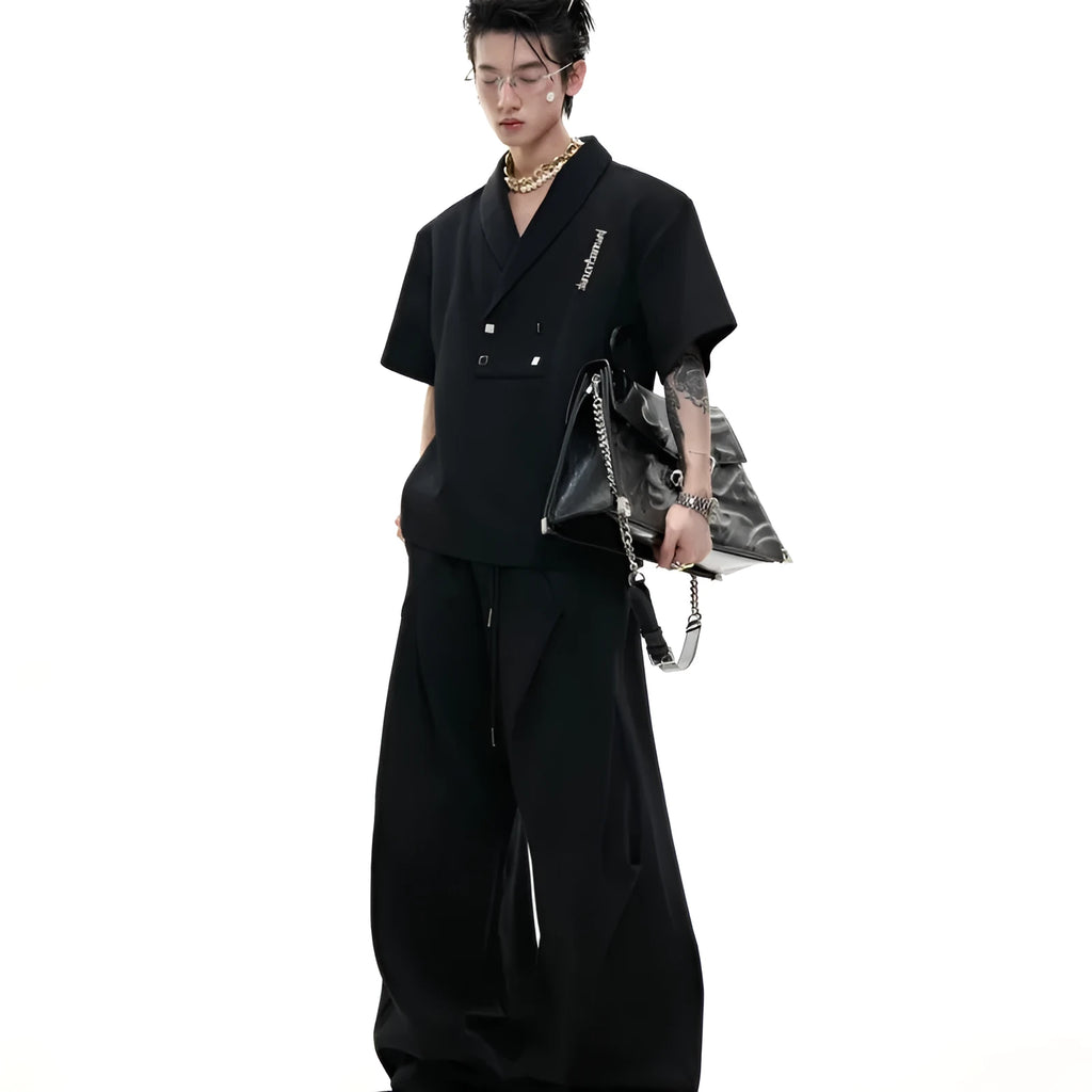 Men's dark grey cotton sports suit with metal-embellished V-neck jacket and matching shorts.