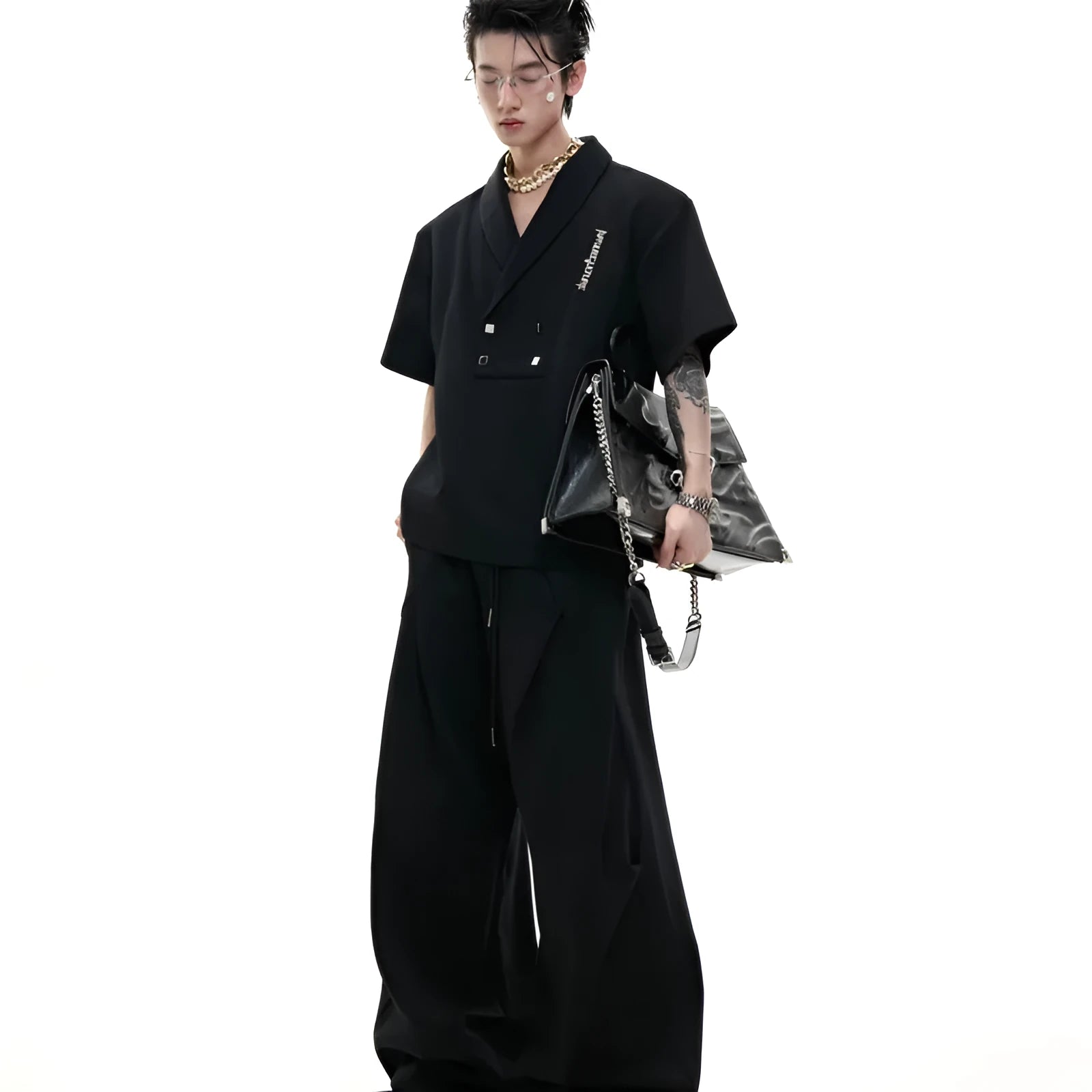 Men's dark grey cotton sports suit with metal-embellished V-neck jacket and matching shorts.