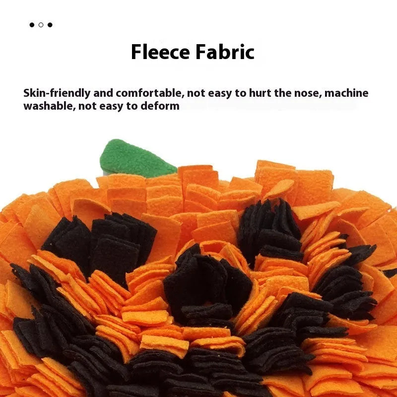 Orange pumpkin-shaped pet smell mat on flat surface showing polar fleece texture