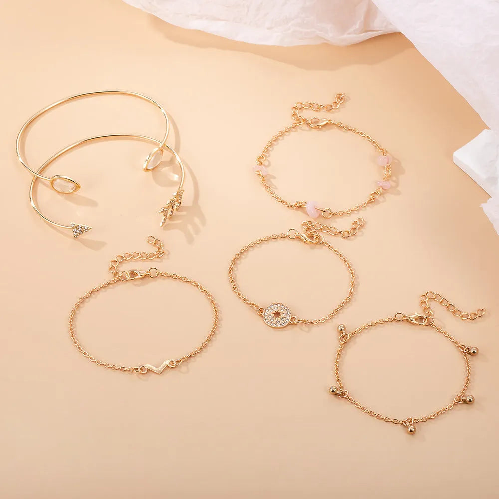 Women's gold jewellery bracelet set with arrow and water drop shapes on zinc alloy