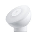 White modern Mijia Night Light 2 Bluetooth bedside lamp with human body induction on wooden table