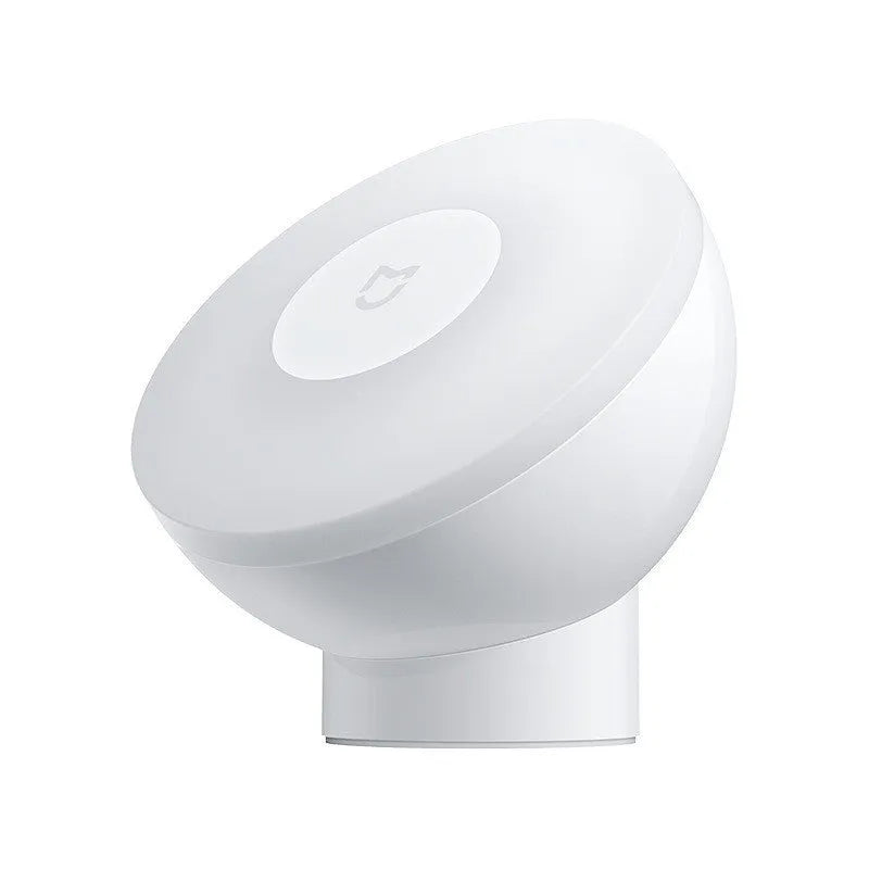 White modern Mijia Night Light 2 Bluetooth bedside lamp with human body induction on wooden table
