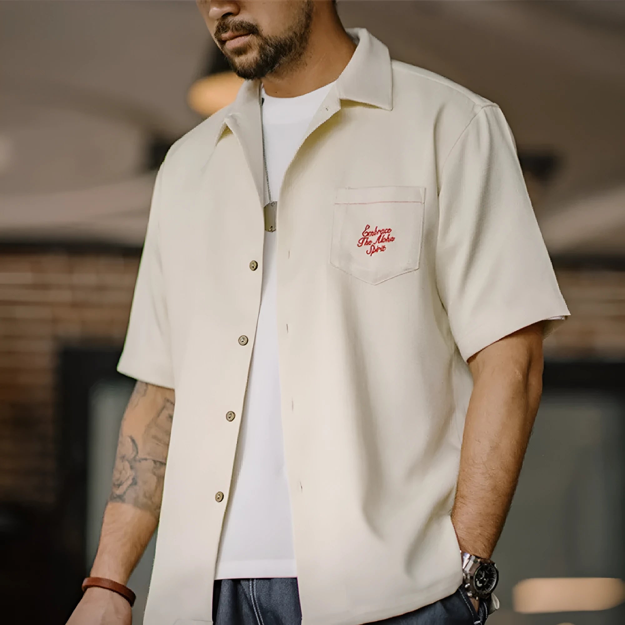 Light apricot men's Cuban collar shirt with an all-over bamboo and floral plant pattern print.