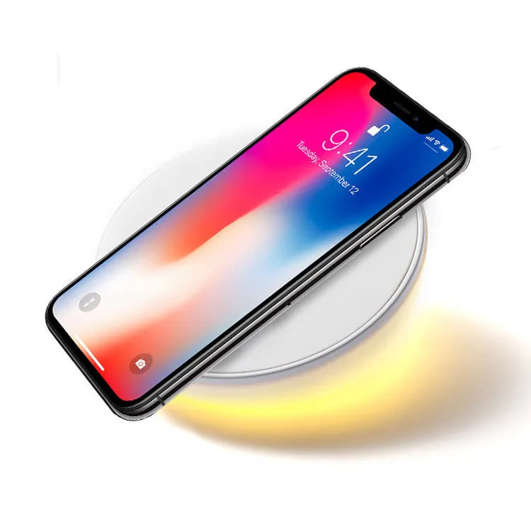 White wireless phone charger with digital clock display and three control buttons