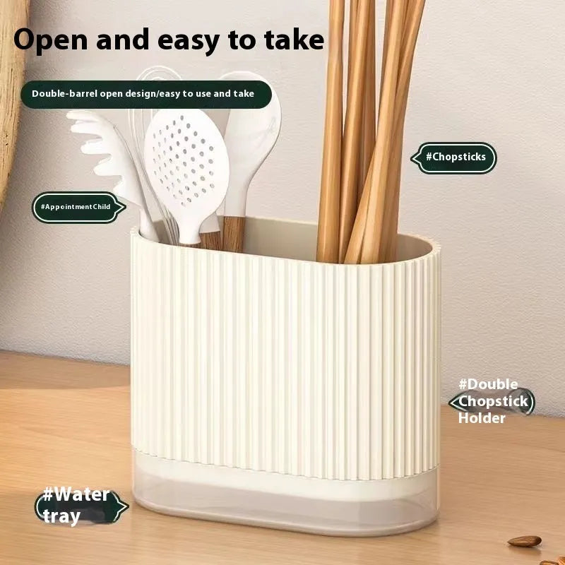 Plastic wall-hanging chopsticks holder tube in kitchen with utensils