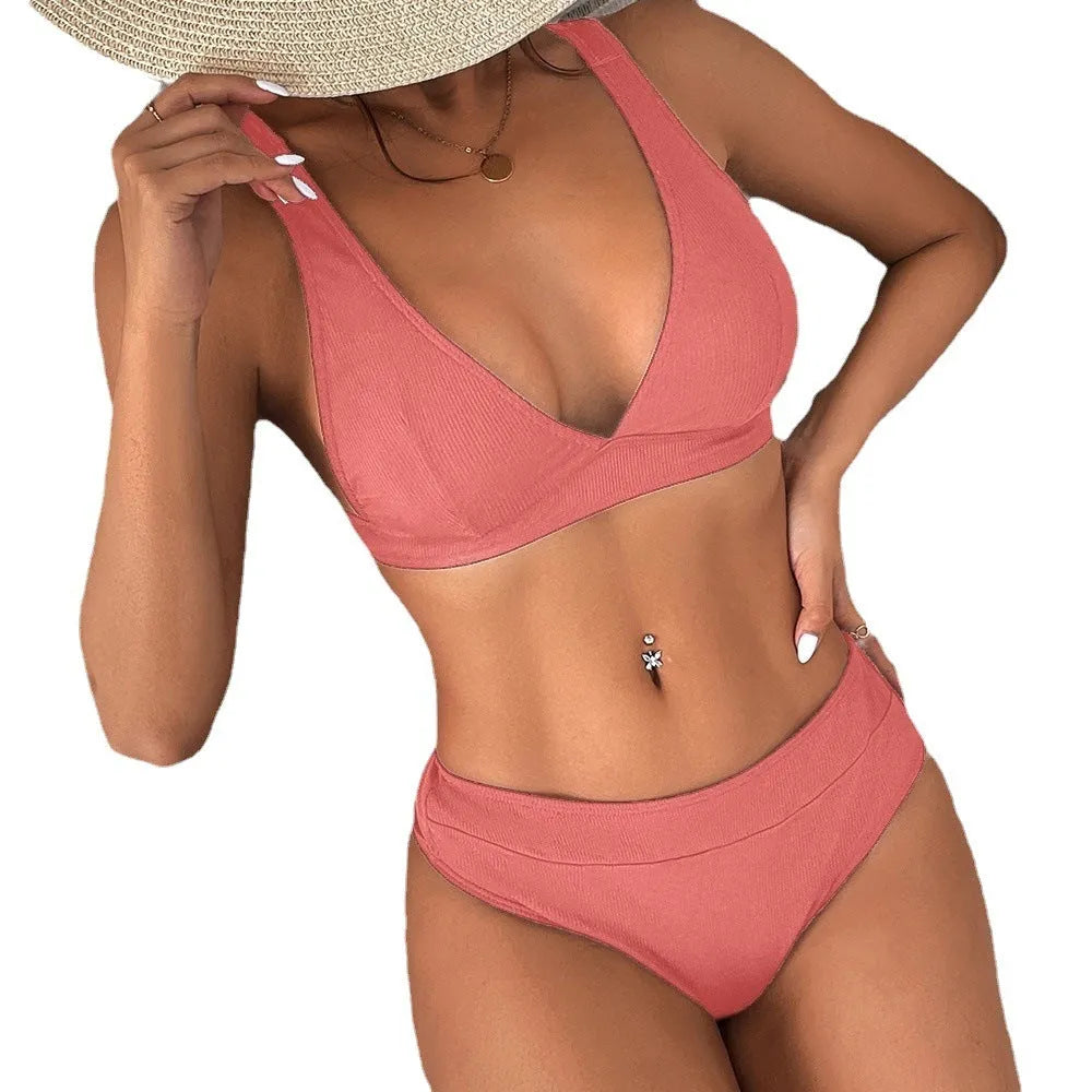 Women's black bikini with lace-up front and high-waisted split bottom.