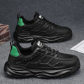 Men's solid colour casual shoes with breathable mesh upper in black or white.