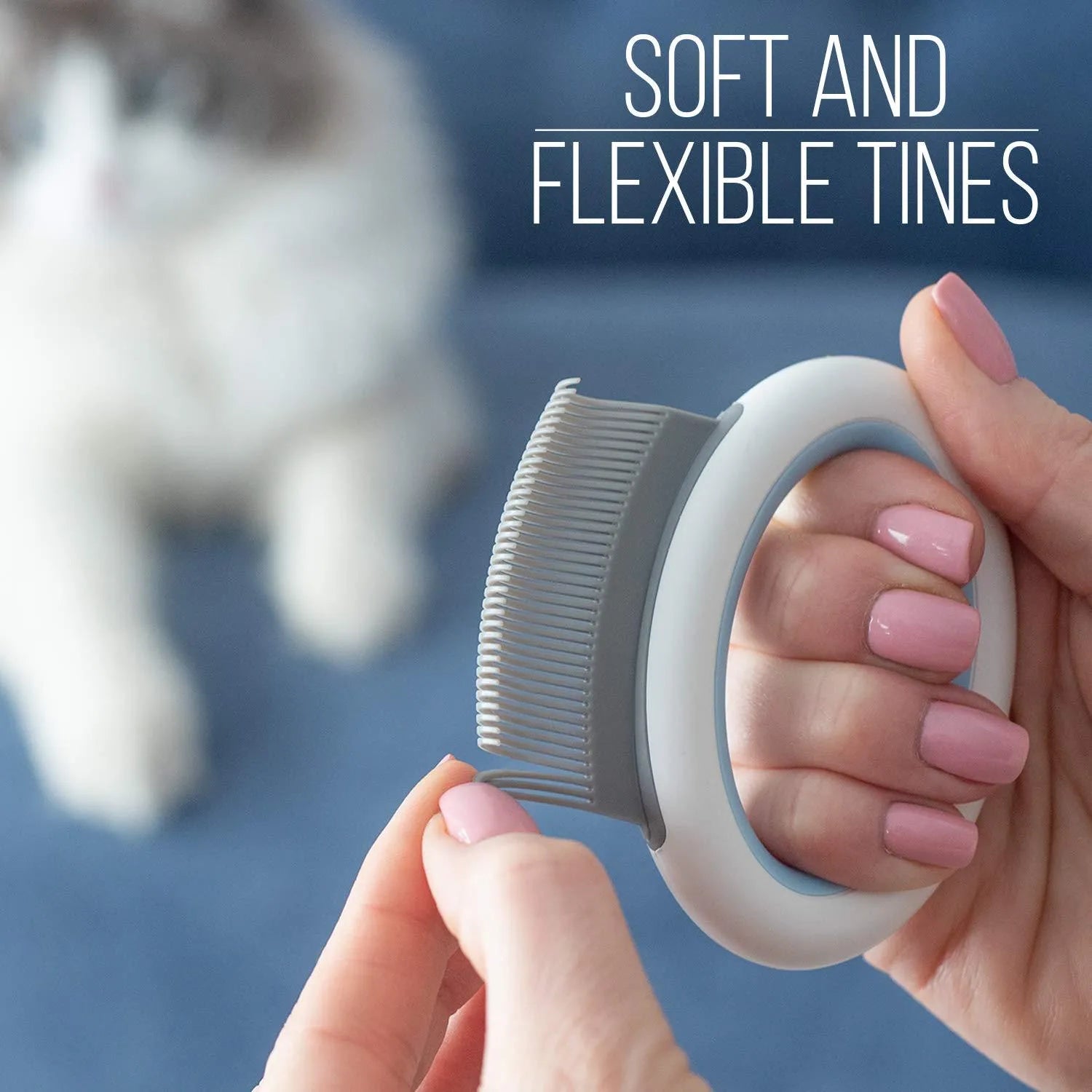 Blue pet grooming comb with soft teeth and ergonomic handle for deshedding cats and dogs.
