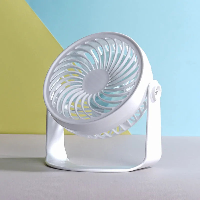 Small white USB desk fan with three blades, shown both clipped to a surface and standing on a desk.