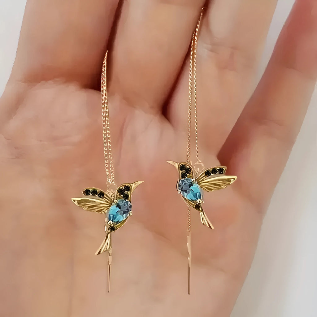 Long bird hanging earrings with mixed zirconium wings in blue, red, and red lvzuan colour options.
