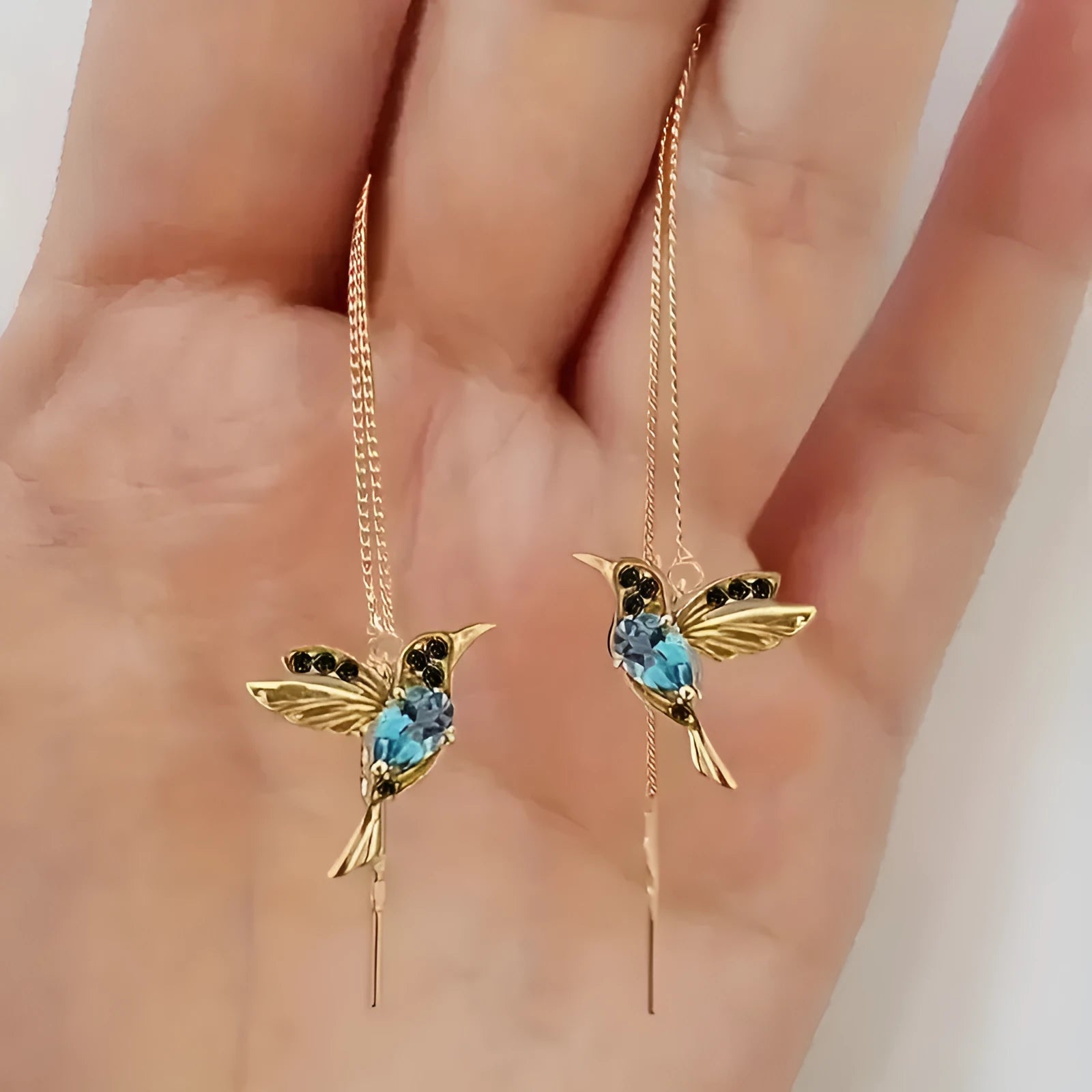 Long bird hanging earrings with mixed zirconium wings in blue, red, and red lvzuan colour options.