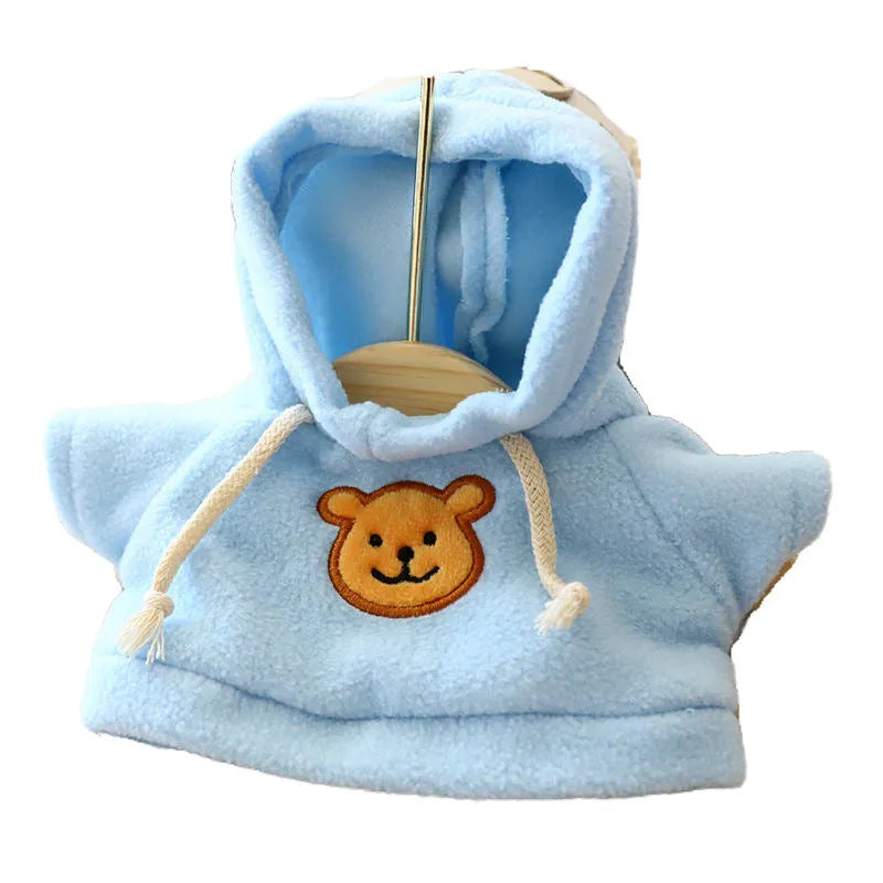 A dog wearing a blue hooded sweater, with size options of 23cm medium and 42cm large available.
