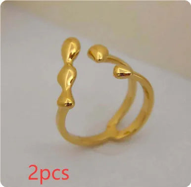 Brass opening ring with spherical elements in gold or silver colour for women's jewellery