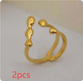 Brass opening ring with spherical elements in gold or silver colour for women's jewellery
