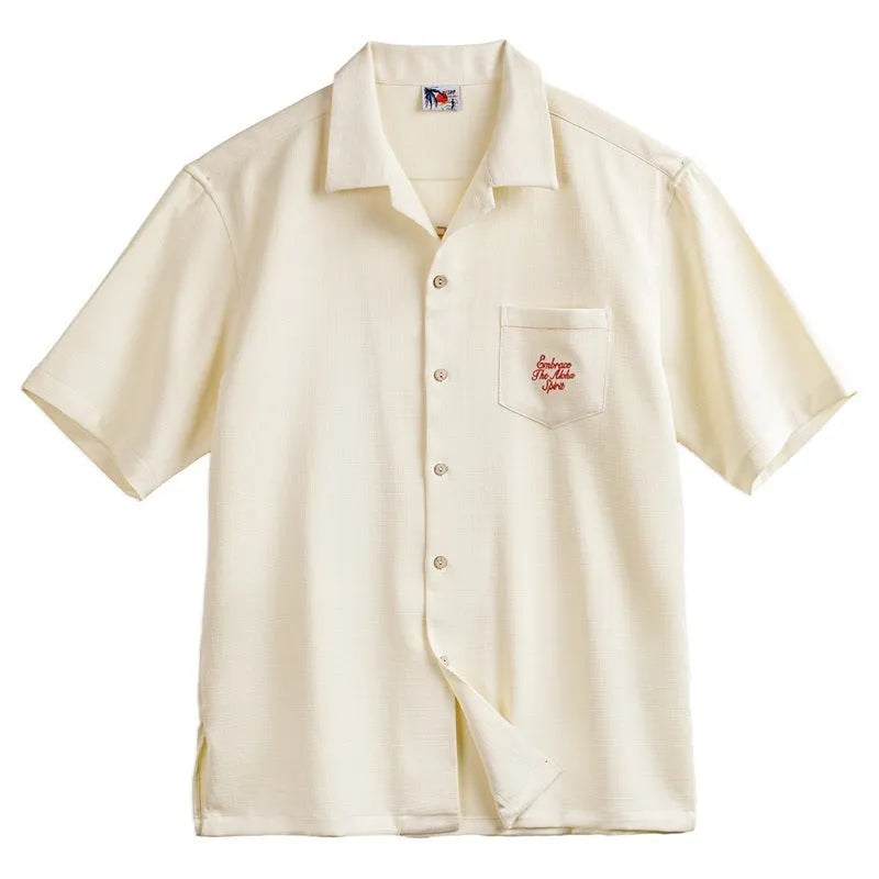 Light apricot men's Cuban collar shirt with an all-over bamboo and floral plant pattern print.