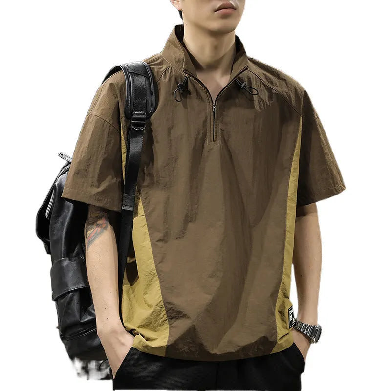 Brown men's loose-fit T-shirt with a half-zip stand collar and short sleeves.