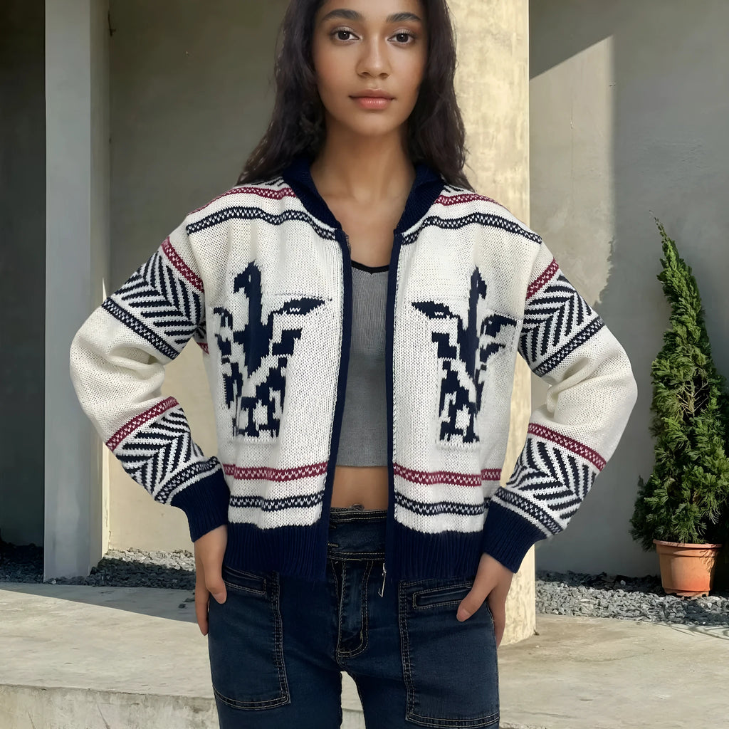 White women's jacquard cardigan with contrast stripes, zipper front, and lapel collar on a hanger.