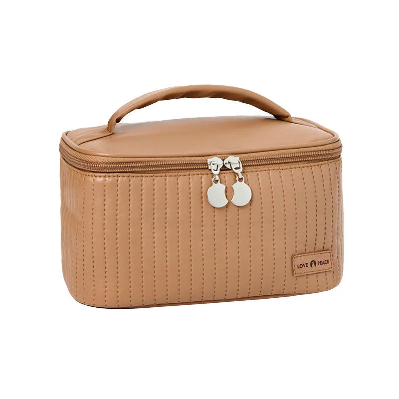 Open-top women's makeup bag in light blue PU leather with a solid colour design.