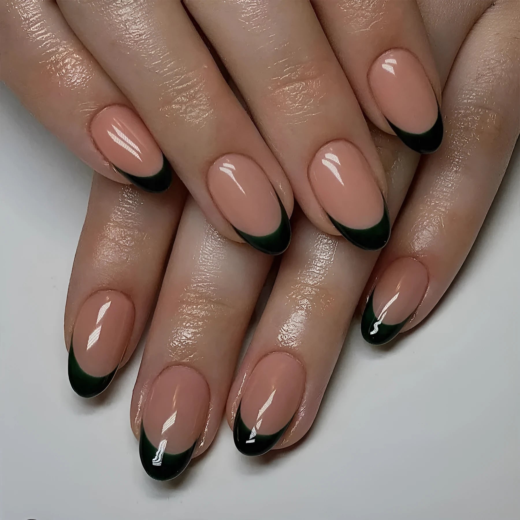 24 black French manicure press-on nails in short almond style arranged as complete set