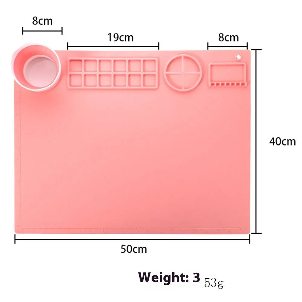 Light blue silicone painting mat with two attached bowls for watercolour supplies.