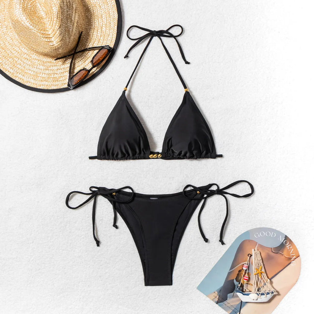 Black women's bikini swimsuit with metal bead decoration on a split-style design