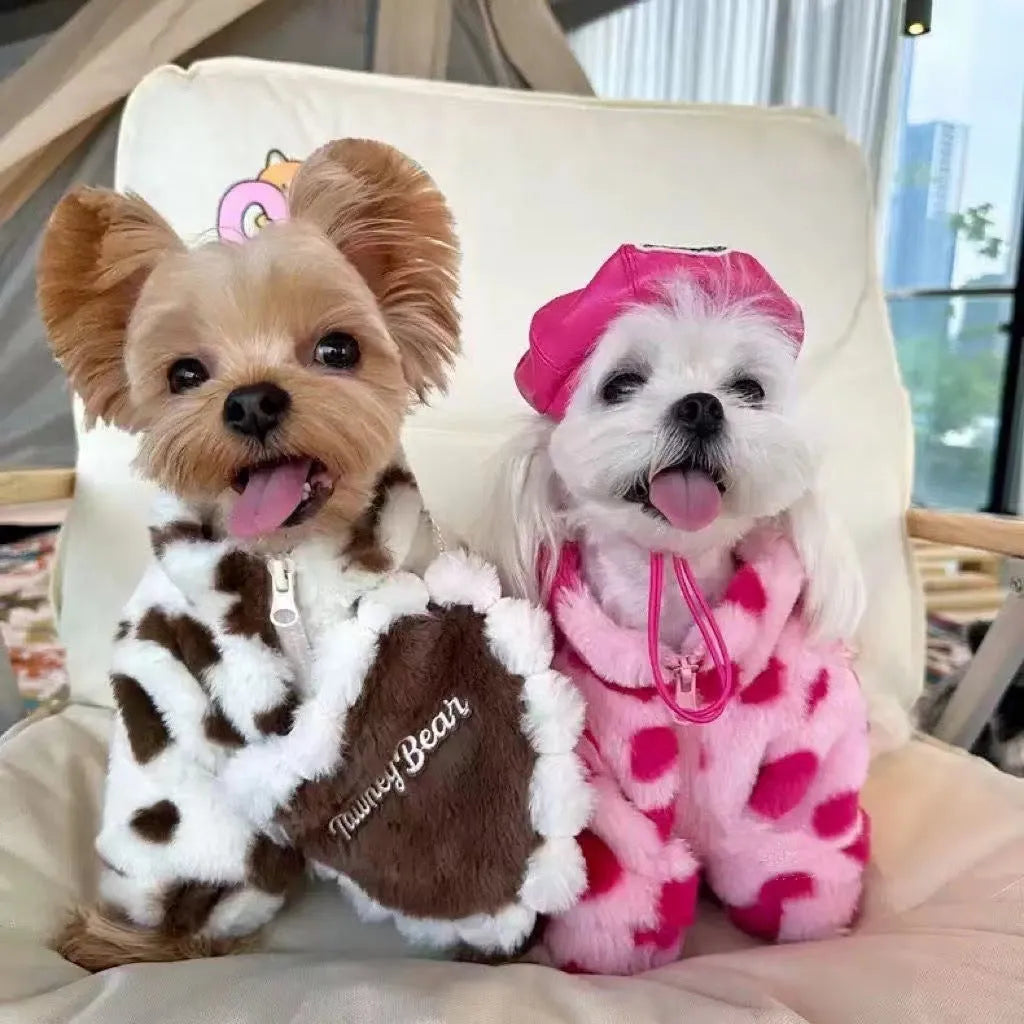 Small dog wearing British-style pink polyester plush winter coat suitable for Pomeranian or Bichon Frise breeds