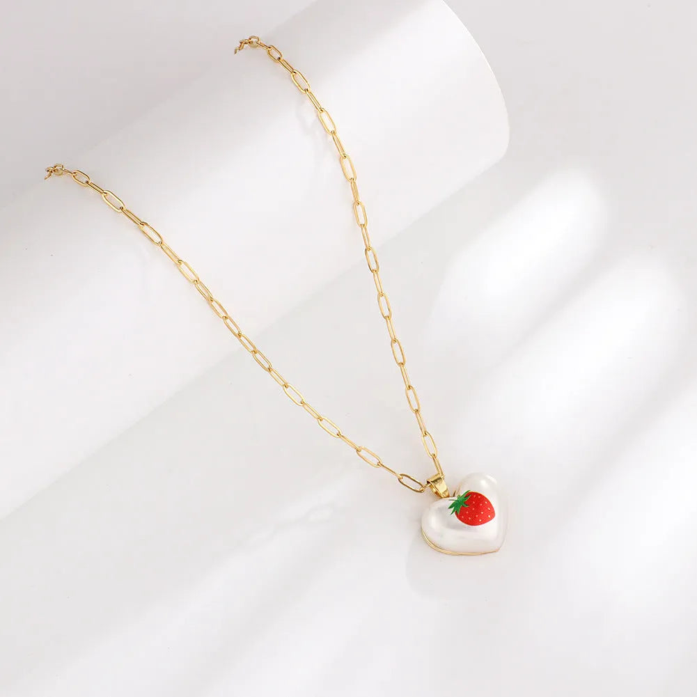 Geometric fruit pendant necklace with adjustable chain showing Apple, Cherry, Pear, Pineapple and Strawberry colour variations