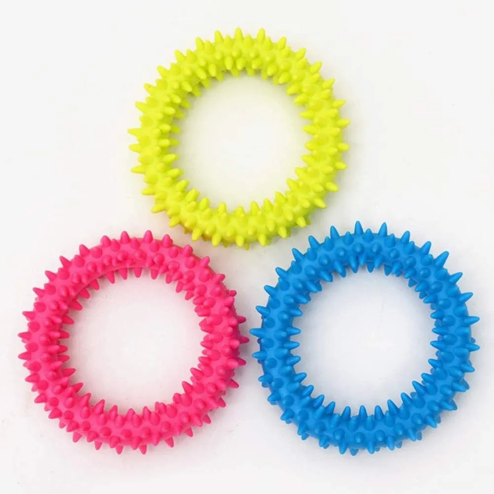 Blue spiky TPR ring dog chew toy for dental cleaning on a white background