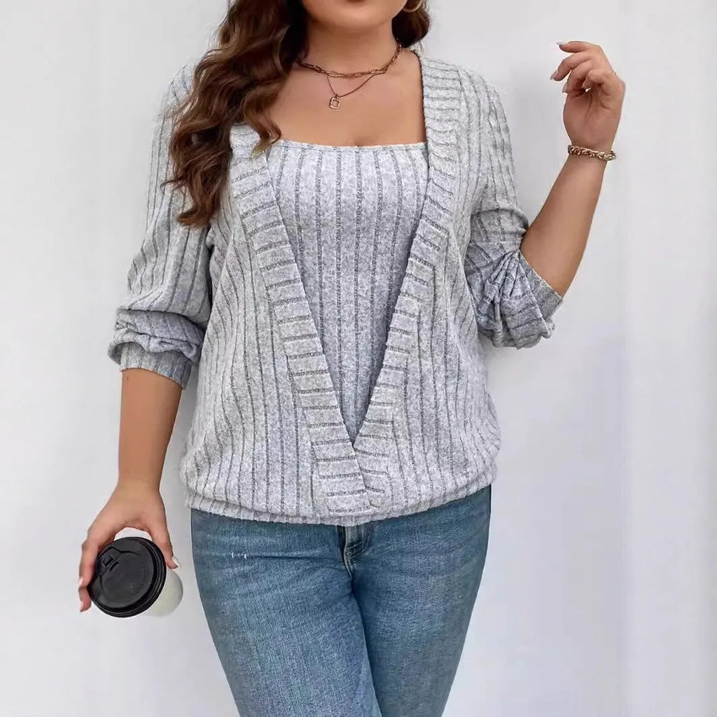 Solid colour V-neck false two-piece suit dress with long sleeves on a hanger