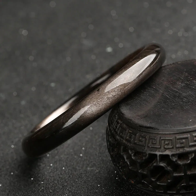 Natural silver stone cat's eye bracelet with geometric patterns on an alloy band.