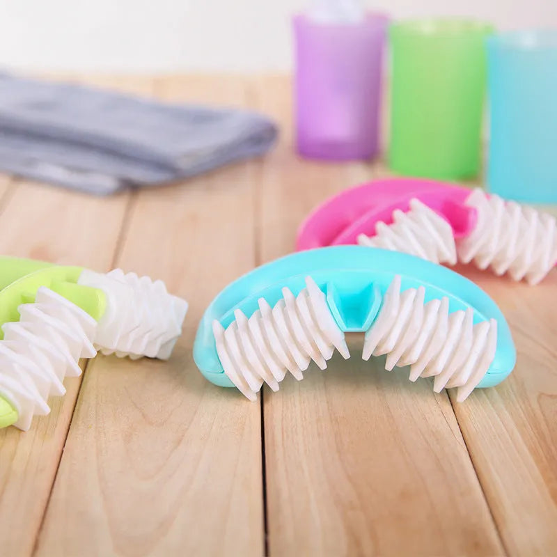 Handheld anti-cellulite massager roller with TPE dot wheels in blue colour on white background