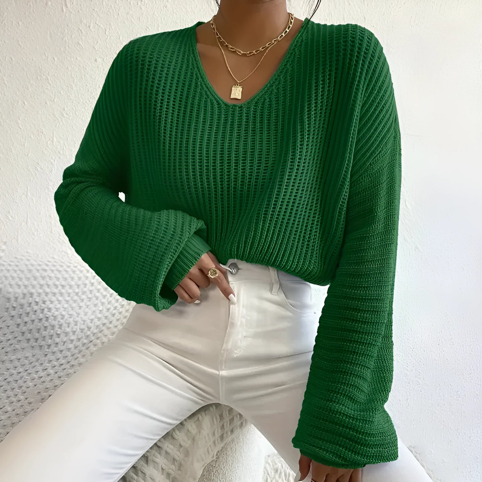 Solid colour long sleeve women's pullover in a loose casual fit, shown in one of five colour options.