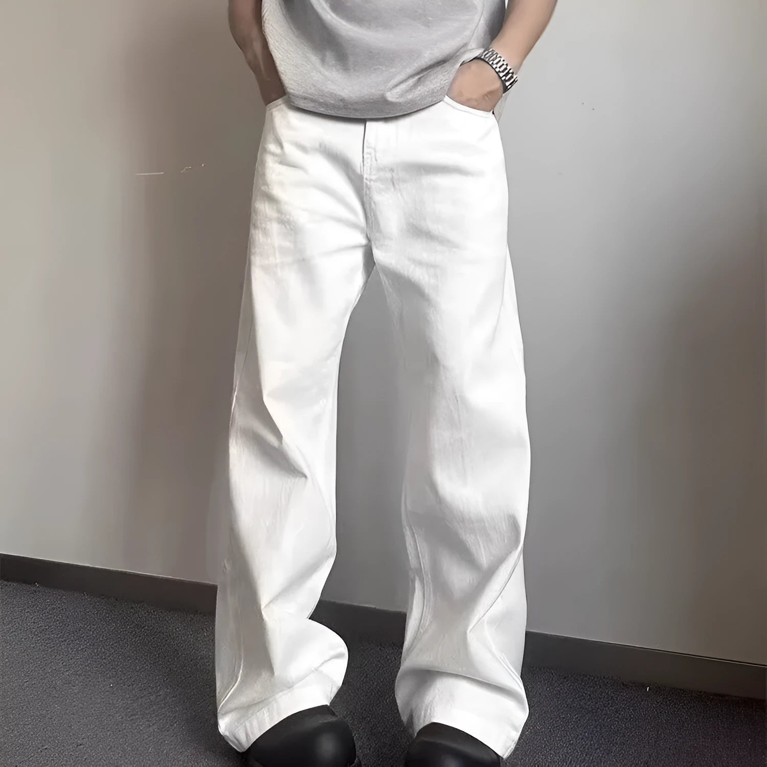 Men's white denim jeans with loose straight wide leg cut and mid waist