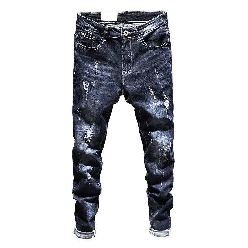 Men's slim-fit skinny jeans in dark blue denim laid flat, showing front design and button fly.