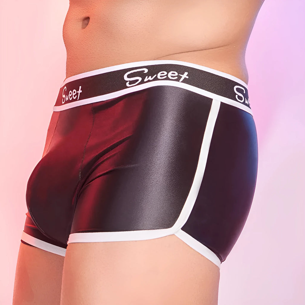 Men's shiny silky nylon boxer shorts in black, white, and sapphire blue colours.