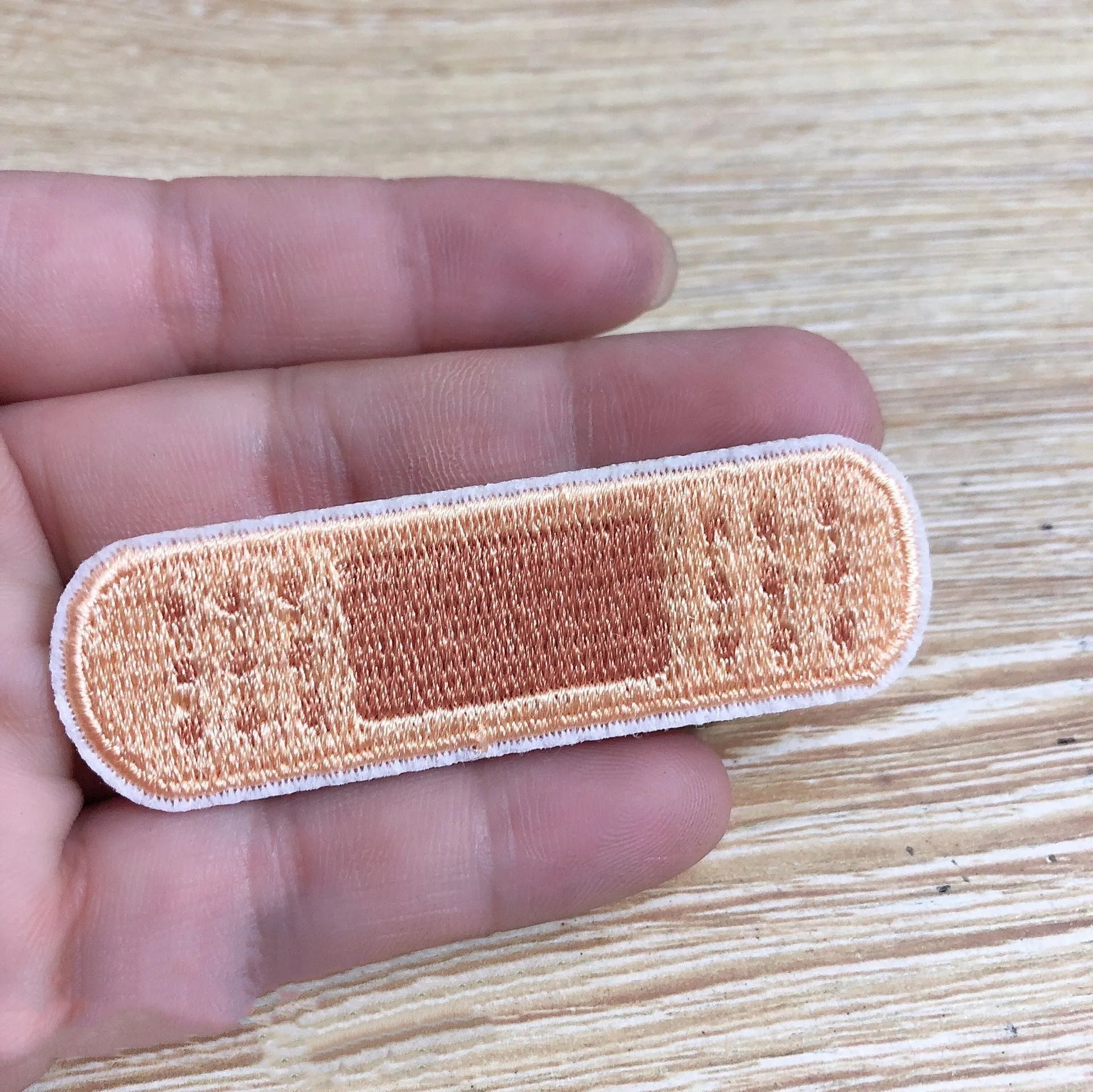 Set of ten embroidered fabric patch badges with lace designs for clothing customisation.