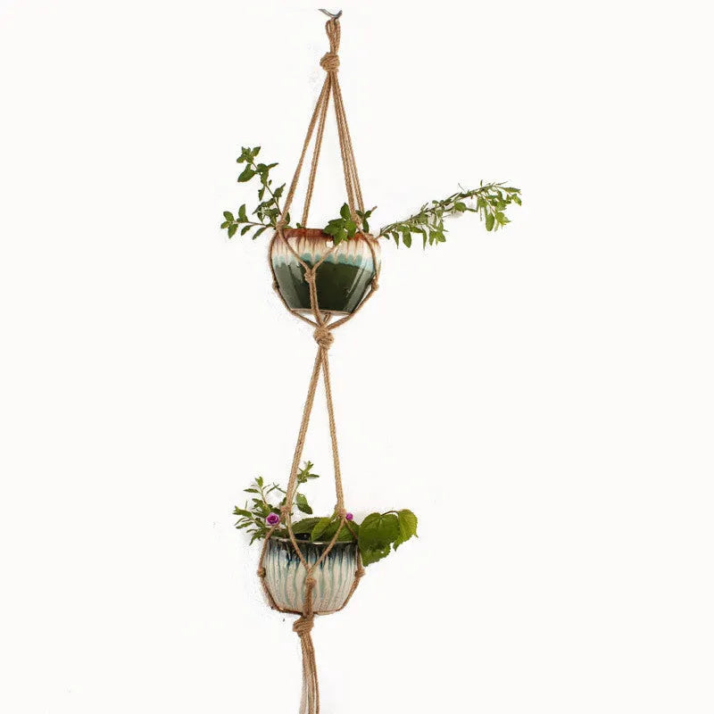 Woven wire and cotton rope macrame plant hanger in a rustic style, shown as a hanging basin.
