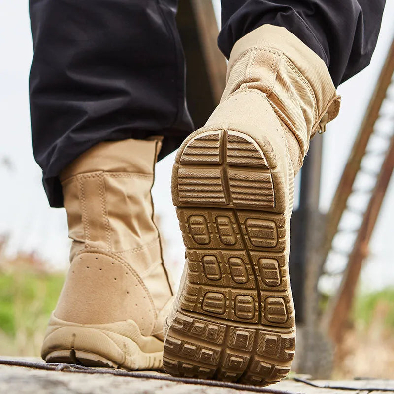 Yulong tactical desert combat boots in black and sand colour on a rocky outdoor terrain.
