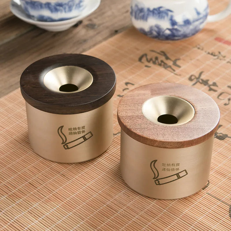 Retro brass ashtray with solid copper construction and hinged wooden lid featuring central circular aperture